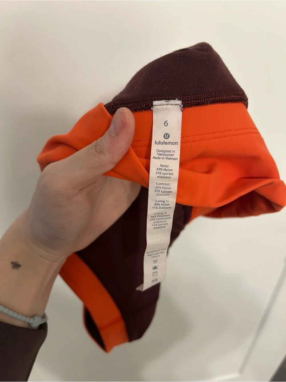 Lululemon Kick Serve Sweat Bra in a tri-color Bordeaux Drama and Orange size 6